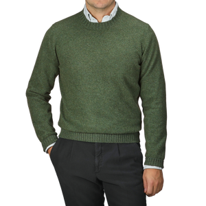 A person wearing a Green Felted Cashmere Crewneck Sweater by Gran Sasso over a collared shirt with black pants, embodying the classic style.