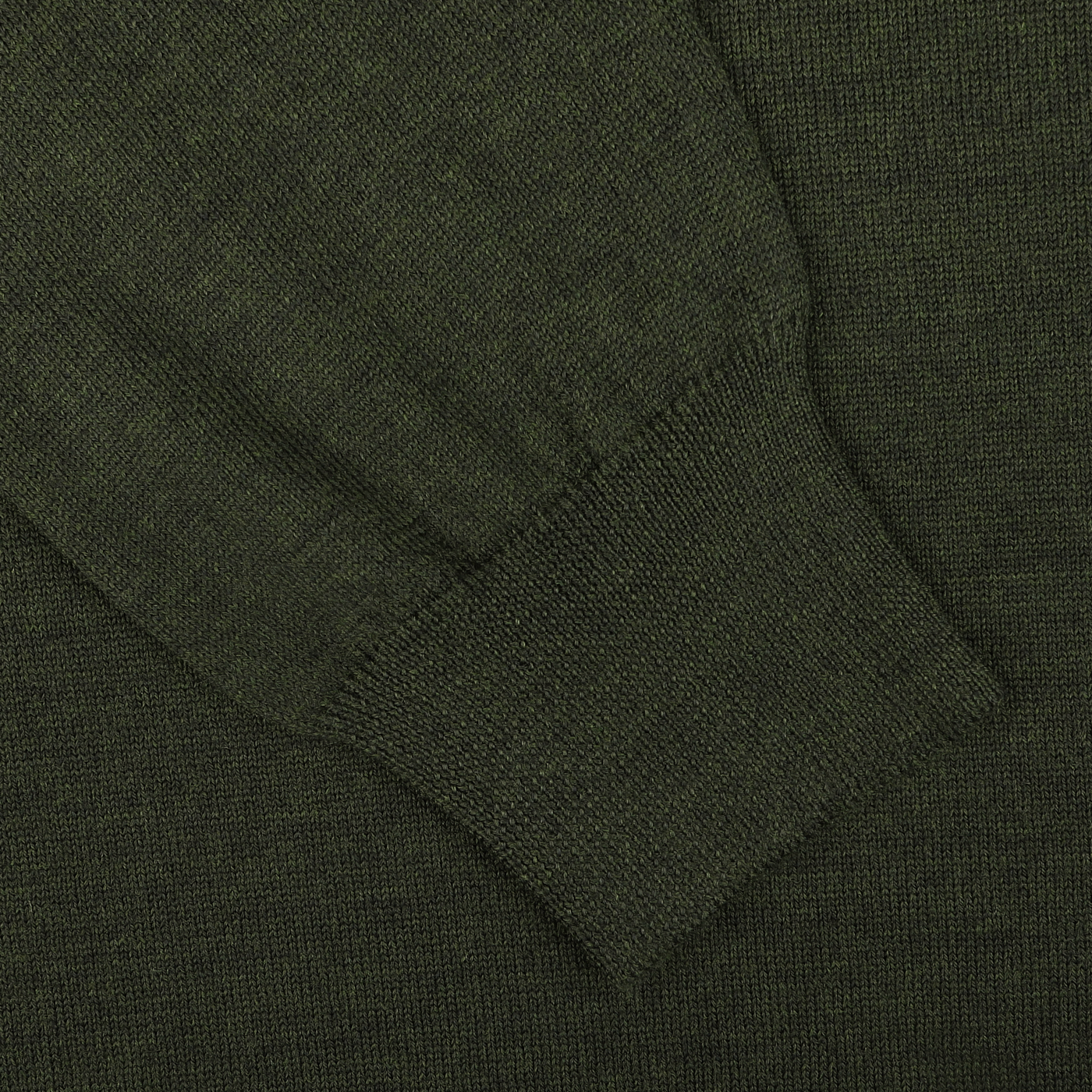 Close-up of the sleeve of the Green Melange Extra Fine Merino Crew Neck by Gran Sasso, highlighting the ribbed cuff and textured fabric, crafted from high-quality merino wool for an added layer of warmth.