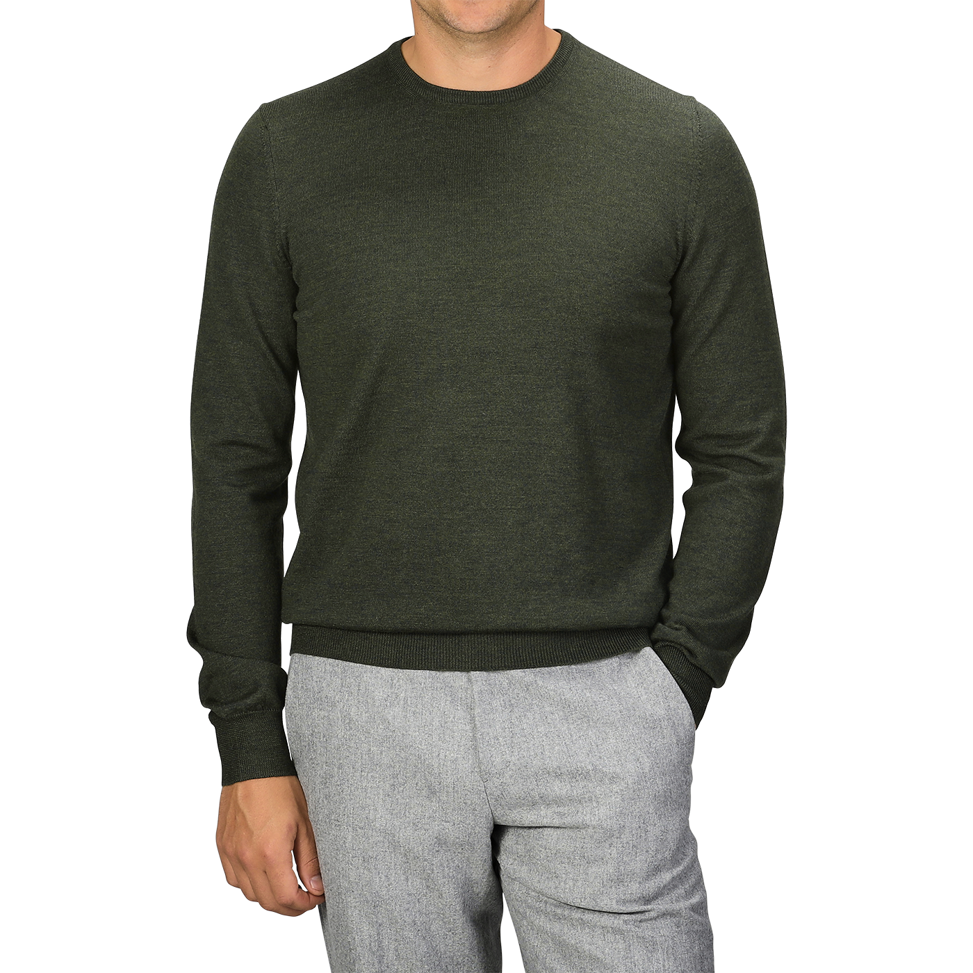 A person wearing a Gran Sasso Green Melange Extra Fine Merino Crew Neck and light gray pants, with hands partially in pockets. The person's face is not visible.