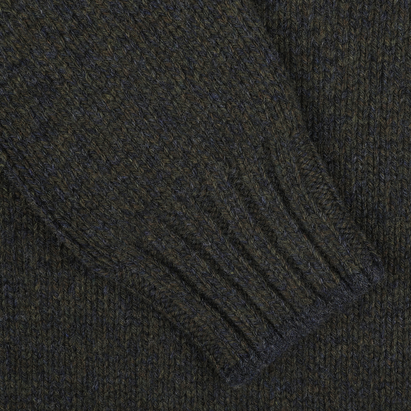 Close-up of a Green Melange Wool Quarter Button Sweater sleeve by Gran Sasso, crafted from luxurious merino wool, featuring ribbed detailing at the wrist.