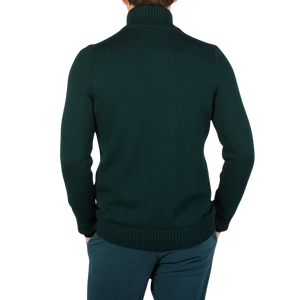 The back view of a man wearing a Green Merino Wool Button Cardigan made by Gran Sasso.