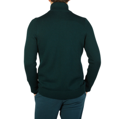 The back view of a man wearing a Green Merino Wool Button Cardigan made by Gran Sasso.