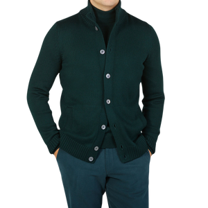 A man wearing a Green Merino Wool Button Cardigan by Gran Sasso.