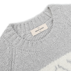 Close-up of the Grey Eco Cashmere Norwegian Crewneck Sweater featuring a ribbed neckline, complete with a "Gran Sasso" label sewn at the back of the collar, highlighting its exquisite design.