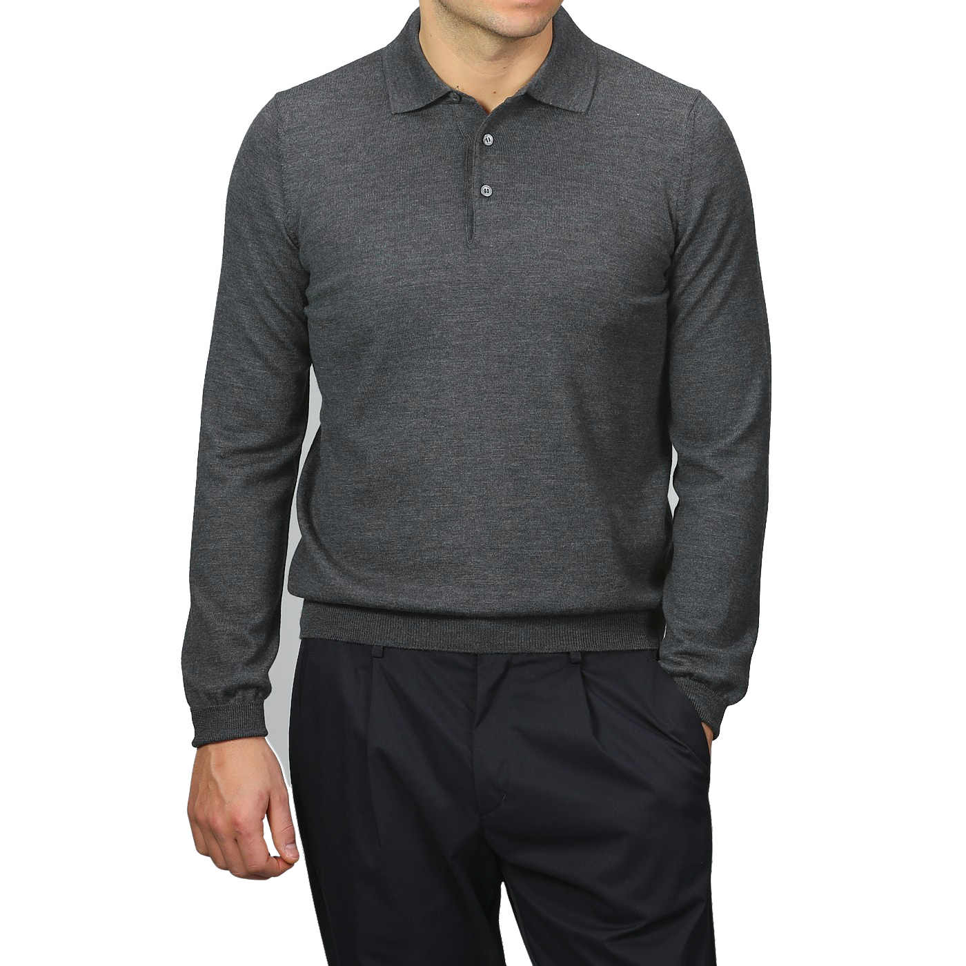 A person in a Gran Sasso Grey Extra Fine Merino Wool Polo Shirt with long sleeves and black pants stands against a plain background.