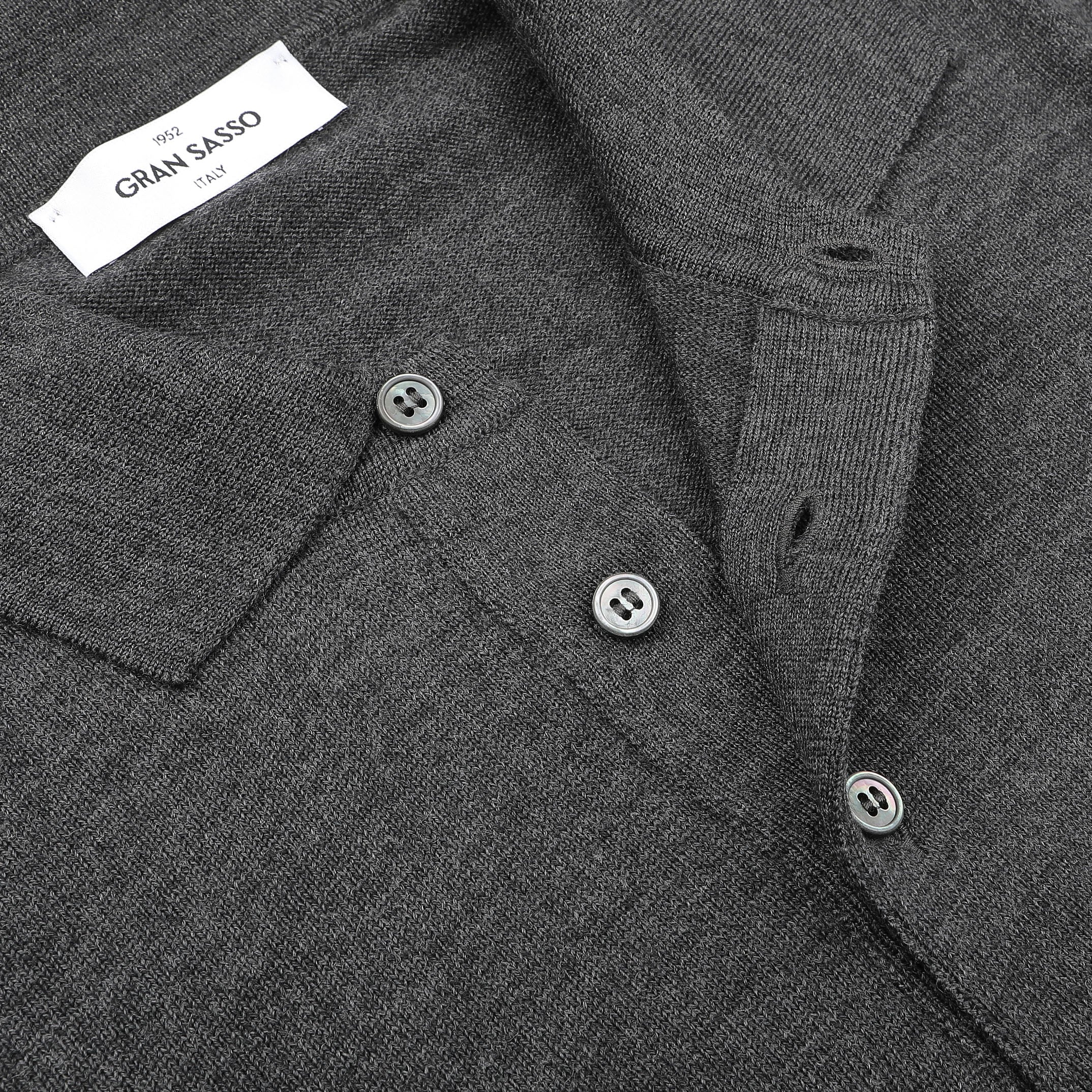 Close-up of the Gran Sasso Grey Extra Fine Merino Wool Polo Shirt, featuring buttons, textured fabric, and a visible label to enhance its sophisticated appeal.