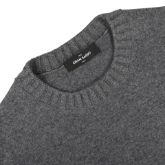 Grey felted cashmere crewneck sweater with a ribbed collar. The label reads "Gran Sasso Italy.