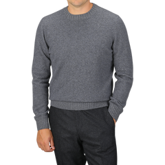 A person is wearing a Gran Sasso Grey Felted Cashmere Crewneck Sweater with black pants, standing against a plain background. Their face is not visible.