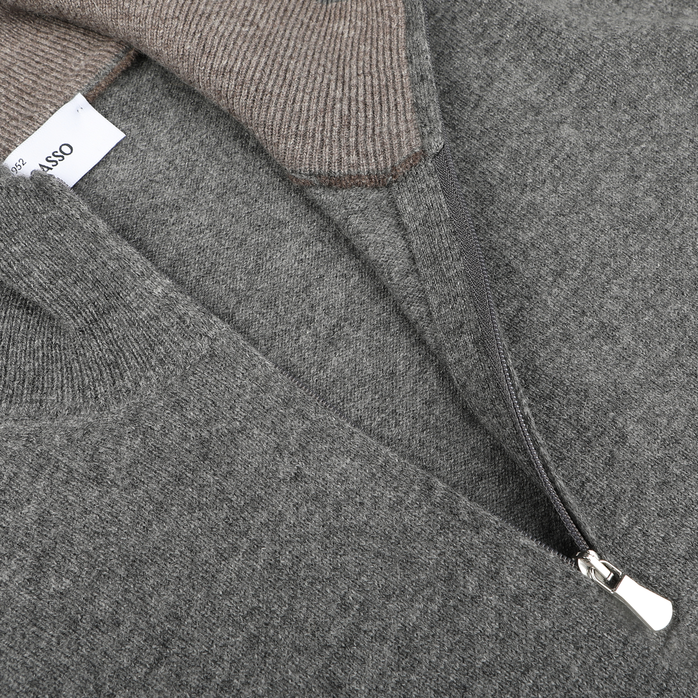 Close-up view of a Gran Sasso Grey Melange Wool Cashmere 1/4 Zip Sweater featuring a high collar and showcasing a partially opened metal zipper with a visible clothing label. This piece exemplifies sustainable knitwear at its finest.