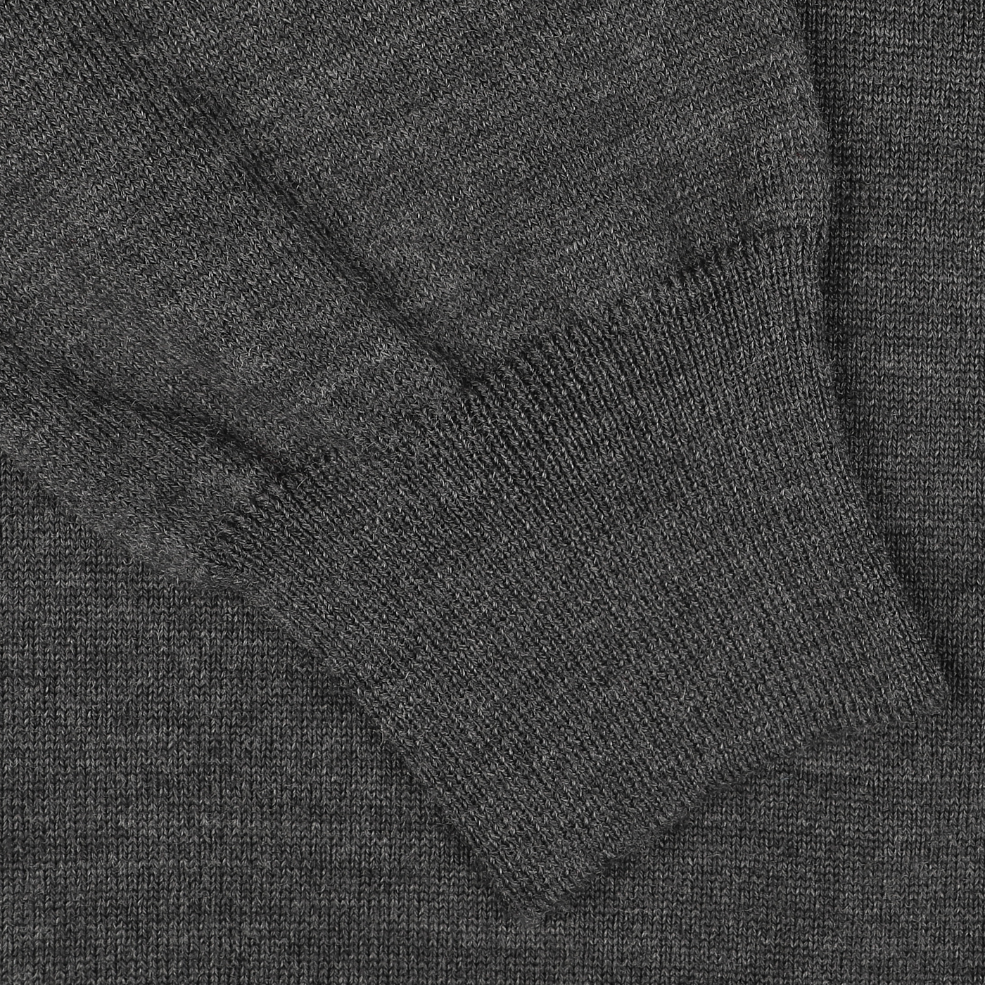 A close-up view of the sleeve and cuff of the Gran Sasso Grey Merino Wool One-Piece Collar Polo Shirt, showcasing its dark gray hue and extra-fine merino wool craftsmanship.