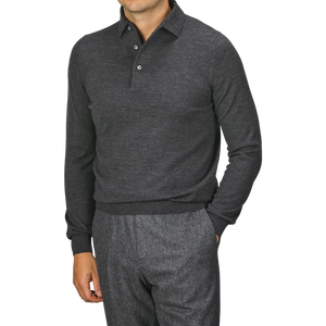 A person wearing a Gran Sasso Grey Merino Wool One-Piece Collar Polo Shirt and gray pants is shown from the shoulders to the thighs against a plain background.