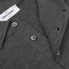 Close-up of a Grey Merino Wool One-Piece Collar Polo Shirt from Gran Sasso, featuring button details and a visible brand label.