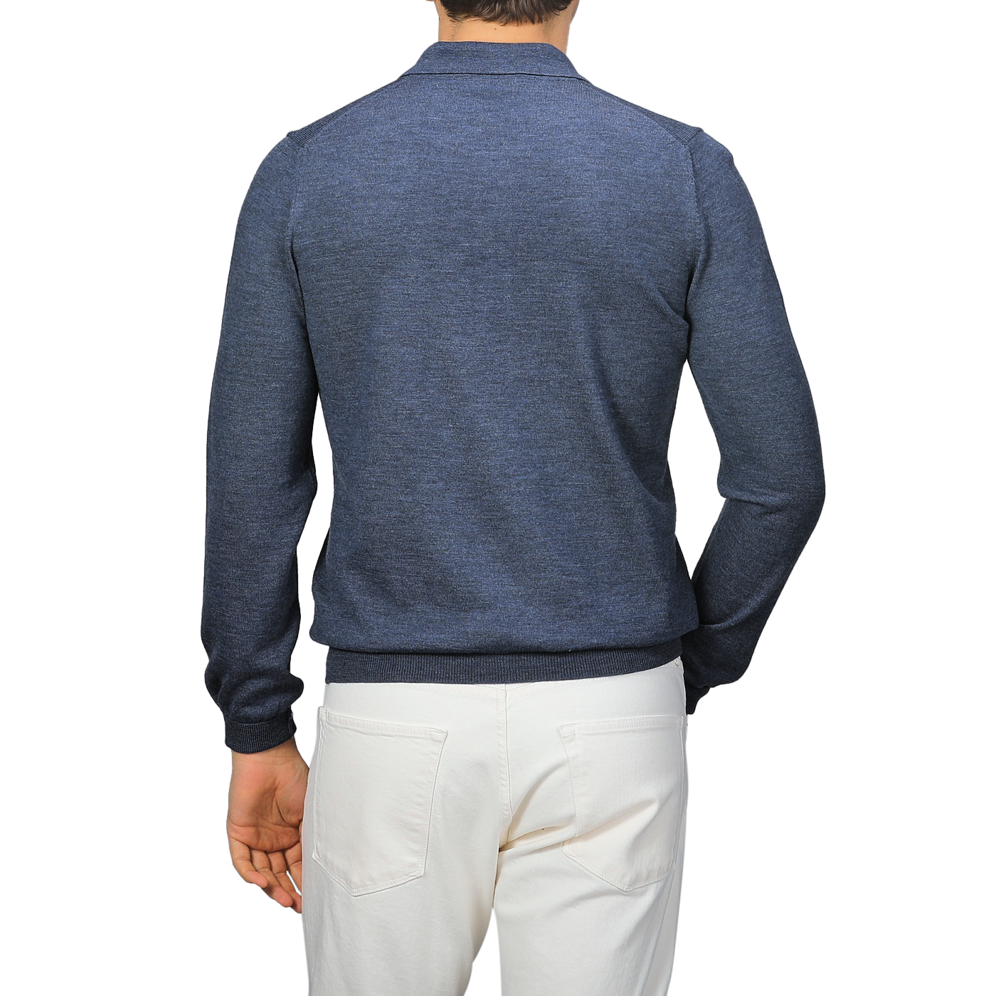 Person in a Gran Sasso Indigo Blue Extra Fine Merino Wool Polo Shirt and white pants, viewed from the back against a neutral background.