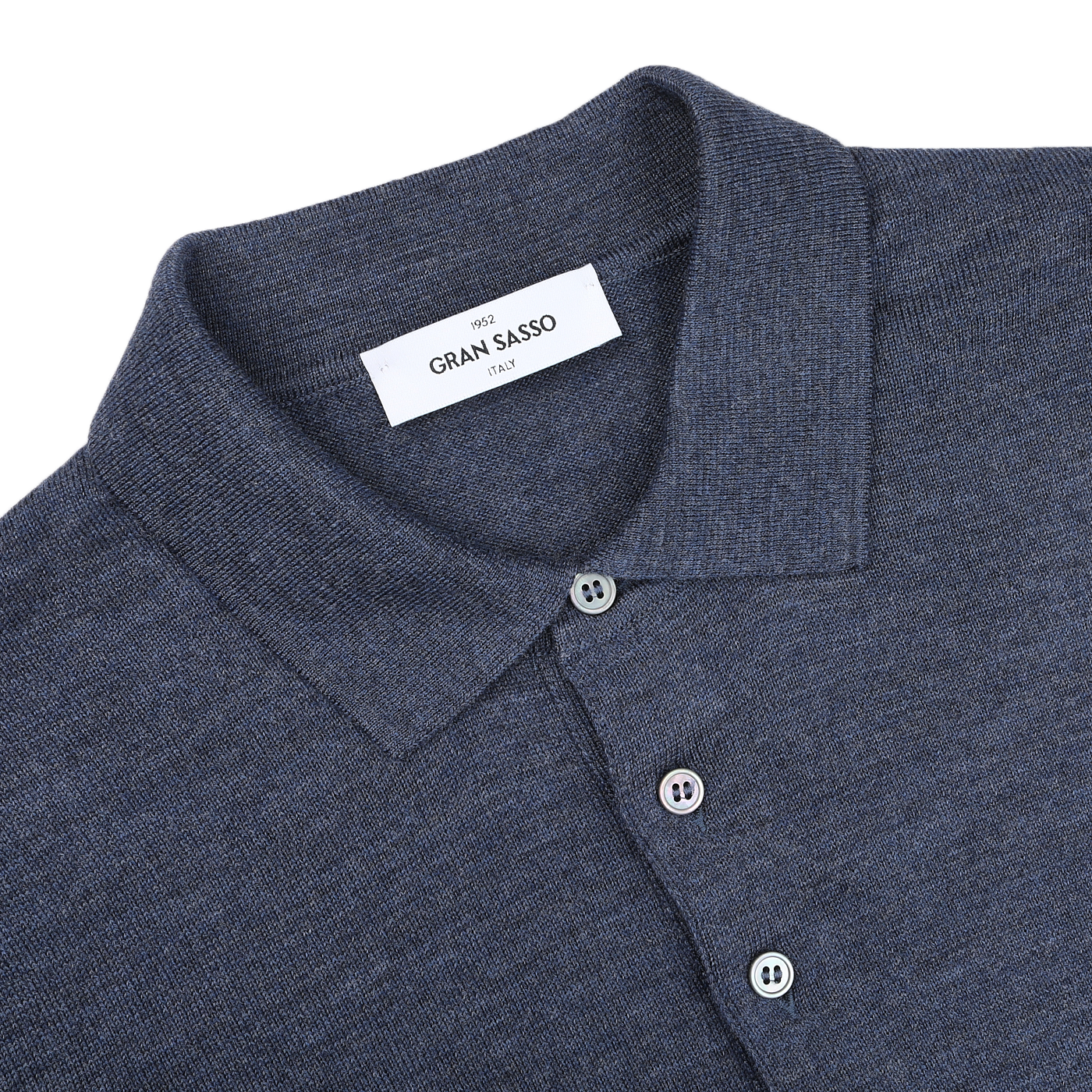 The Indigo Blue Extra Fine Merino Wool Polo Shirt by Gran Sasso features a sleek design with two buttons and "Gran Sasso Italy" elegantly labeled on the inside.