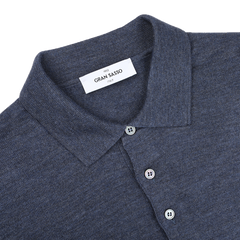 The Indigo Blue Extra Fine Merino Wool Polo Shirt by Gran Sasso features a sleek design with two buttons and "Gran Sasso Italy" elegantly labeled on the inside.