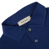 Close-up of an Indigo Blue Organic Cotton LS Polo Shirt collar with a Gran Sasso label.