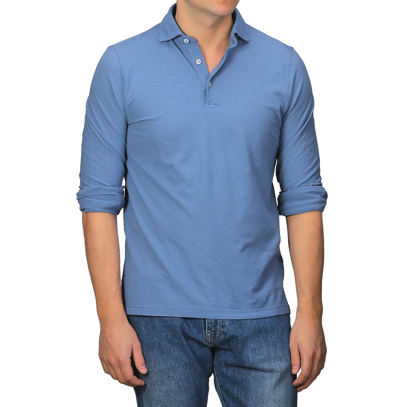 A person wearing a Gran Sasso Indigo Blue Washed Cotton Popover Shirt with rolled-up sleeves and blue jeans stands against a plain background.