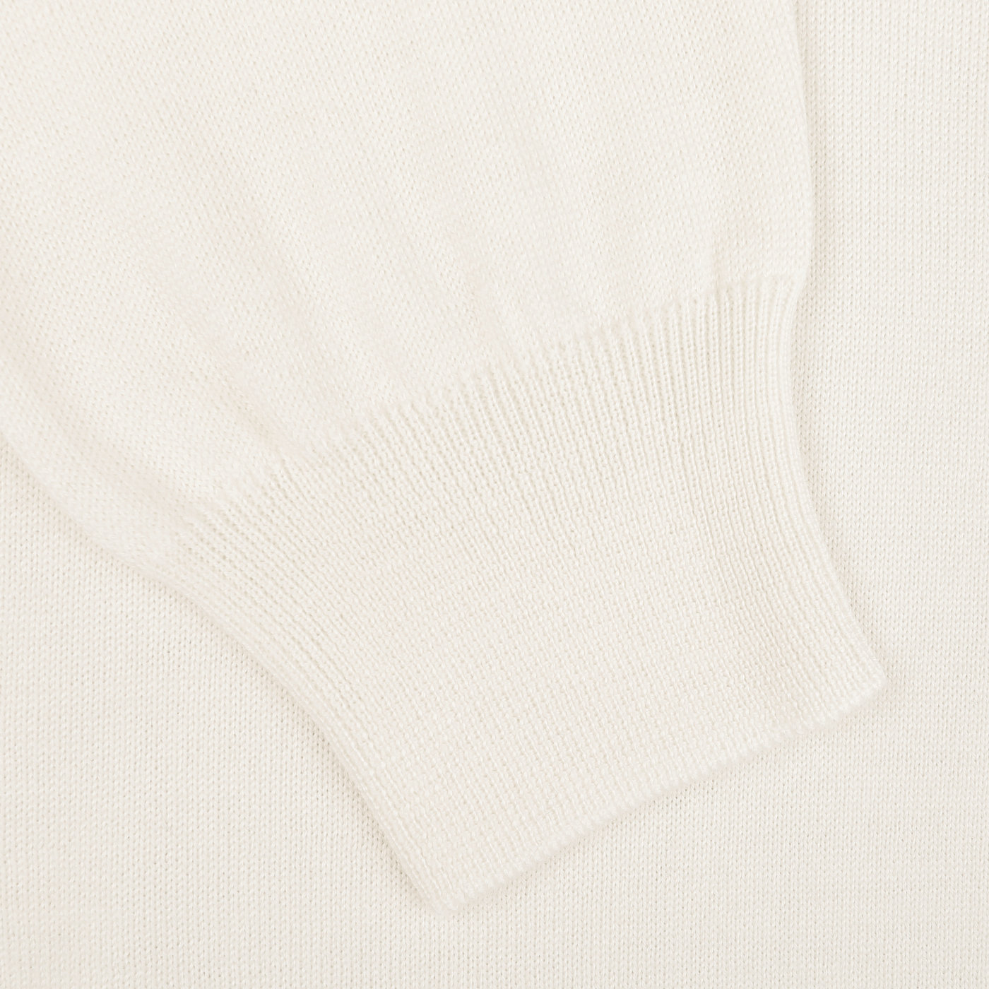 Close-up of a sleeve cuff on the Ivory Merino Wool One-Piece Collar Polo Shirt by Gran Sasso, featuring ribbed detailing. The texture suggests a soft, cozy fabric made from extra-fine merino wool.