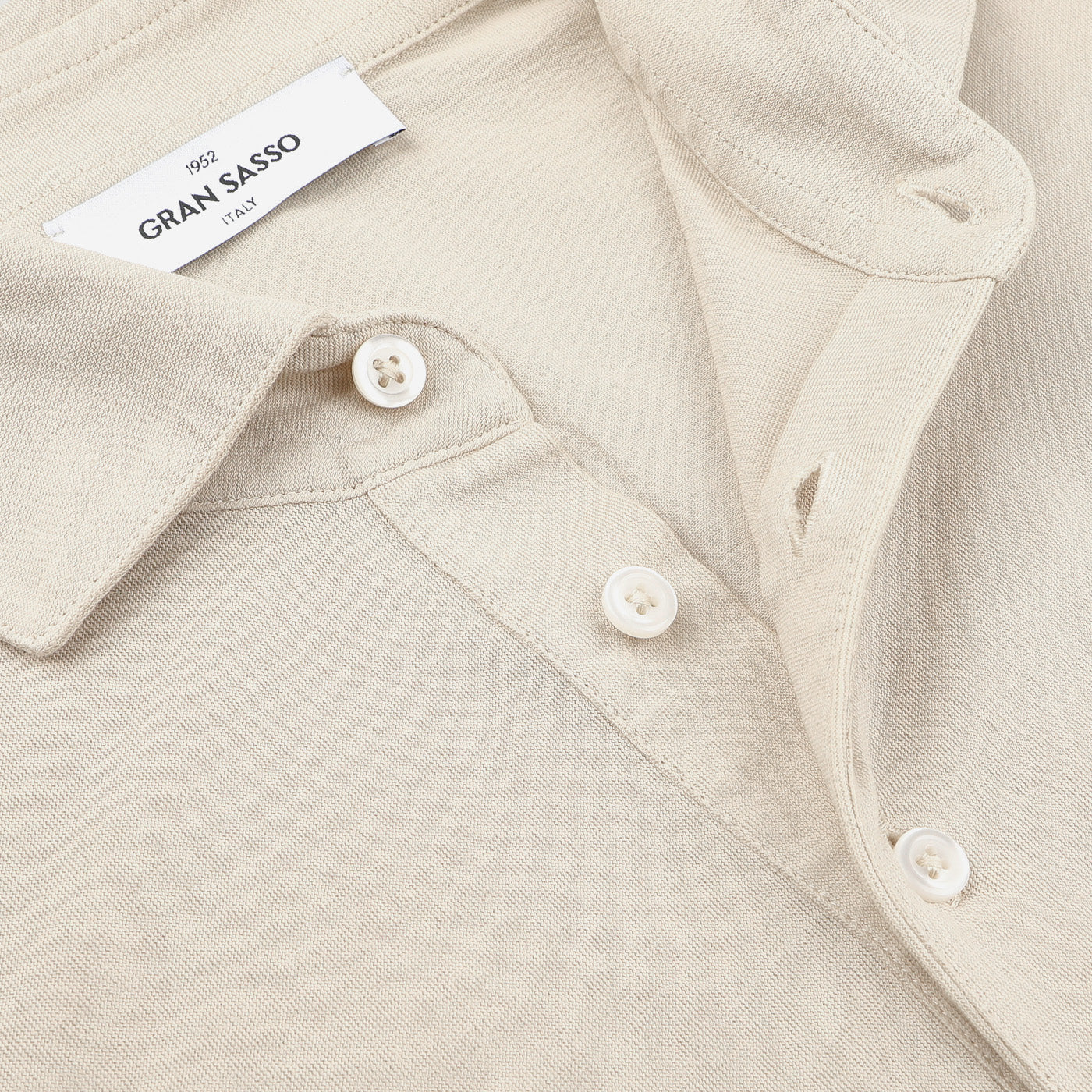 A close-up of Gran Sasso's Light Beige Washed Cotton Popover Shirt, showcasing its button-down collar and button details.