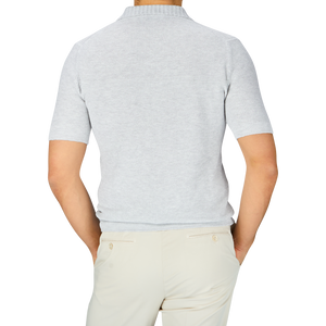 A man in a Gran Sasso light grey cotton linen polo shirt.