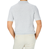 A man in a Gran Sasso light grey cotton linen polo shirt.