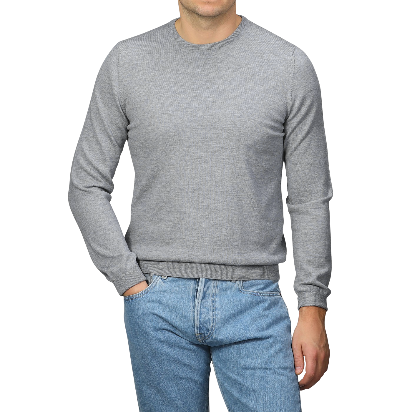 A person wearing a Gran Sasso Light Grey Extra Fine Merino Crew Neck and blue jeans stands against a gray background.