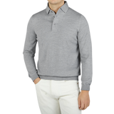 A man stylishly dressed in a Gran Sasso Light Grey Merino Wool One-Piece Collar Polo Shirt.