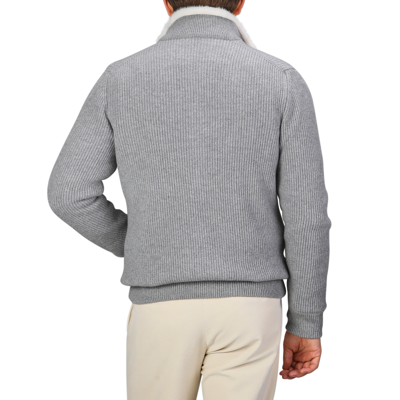 A person wearing a luxurious Gran Sasso Light Grey Faux Fur Lined Cashmere Blouson and beige pants, seen from the back, against a plain background.