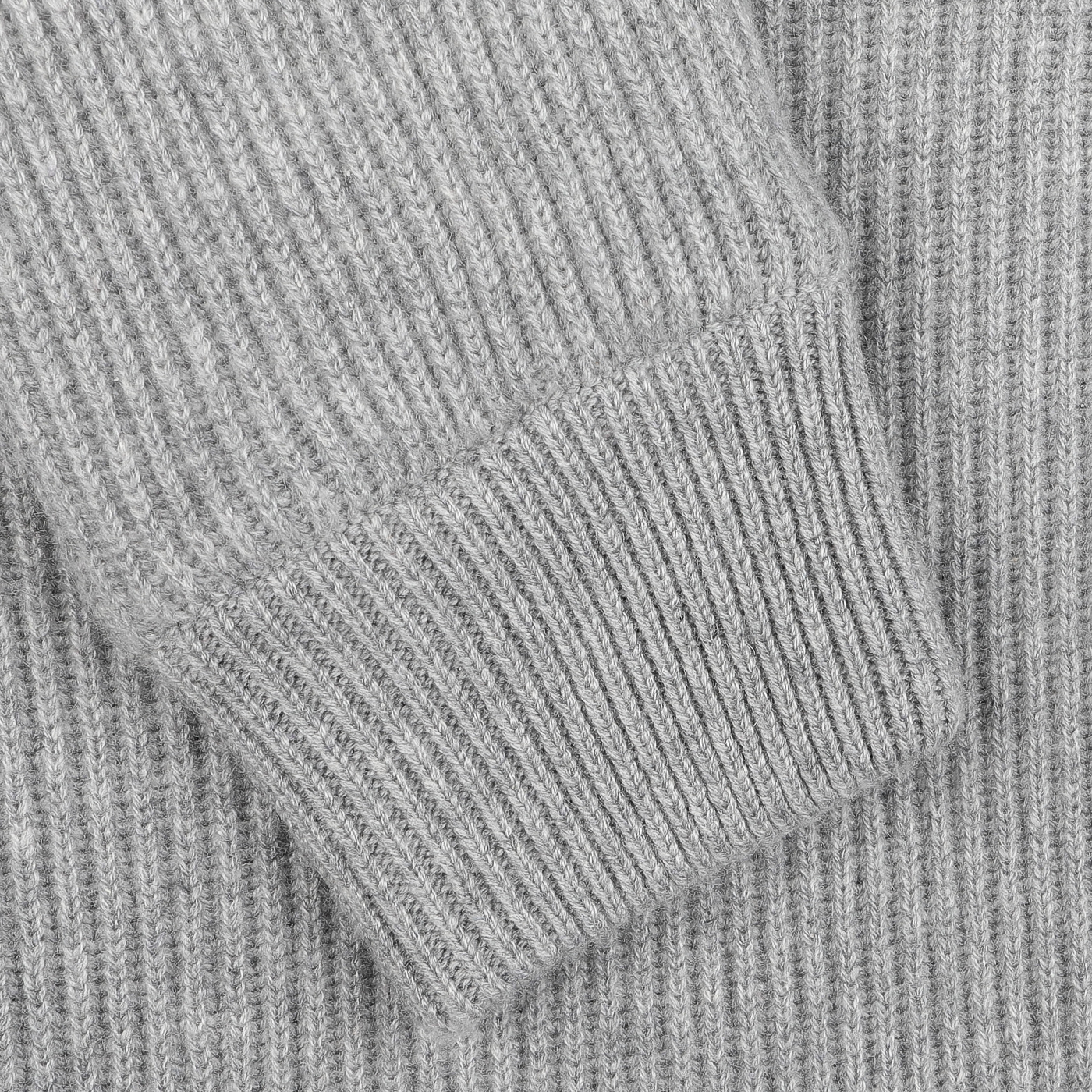 Close-up of a sleeve from the Light Grey Faux Fur Lined Cashmere Blouson, elegantly folded over itself, highlighting the exquisite craftsmanship of Gran Sasso luxury knitwear.