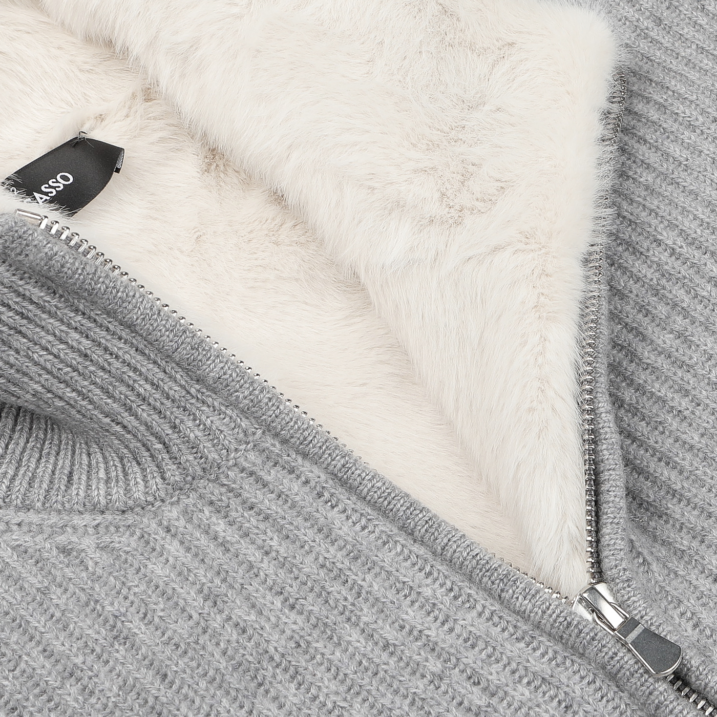 Close-up of the Light Grey Faux Fur Lined Cashmere Blouson by Gran Sasso, showcasing luxury knitwear style with a silver zipper and a hint of soft cream-colored fleece lining.