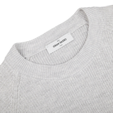 A close up of a Gran Sasso light grey linen cotton t-shirt with a label on it.