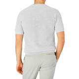 The back view of a man wearing a Gran Sasso Light Grey Linen Cotton T-shirt made with cotton-linen thread.