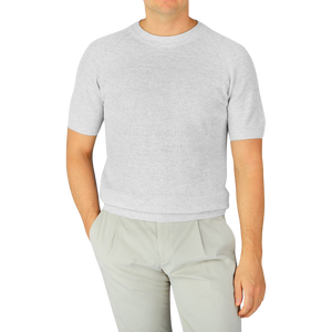A man wearing a Light Grey Linen Cotton T-shirt by Gran Sasso.