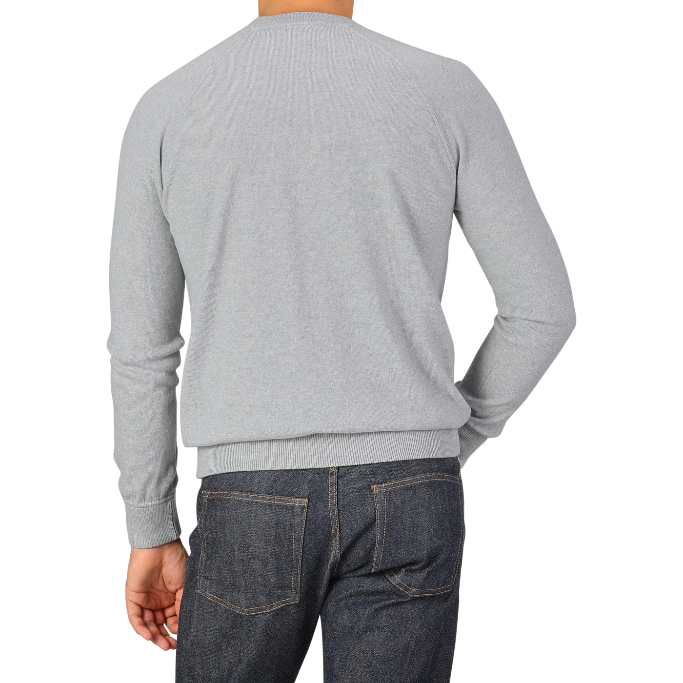 A person wearing a Gran Sasso Light Grey Wool Cashmere College Sweater and dark jeans is shown from the back, with their left hand in their pocket.