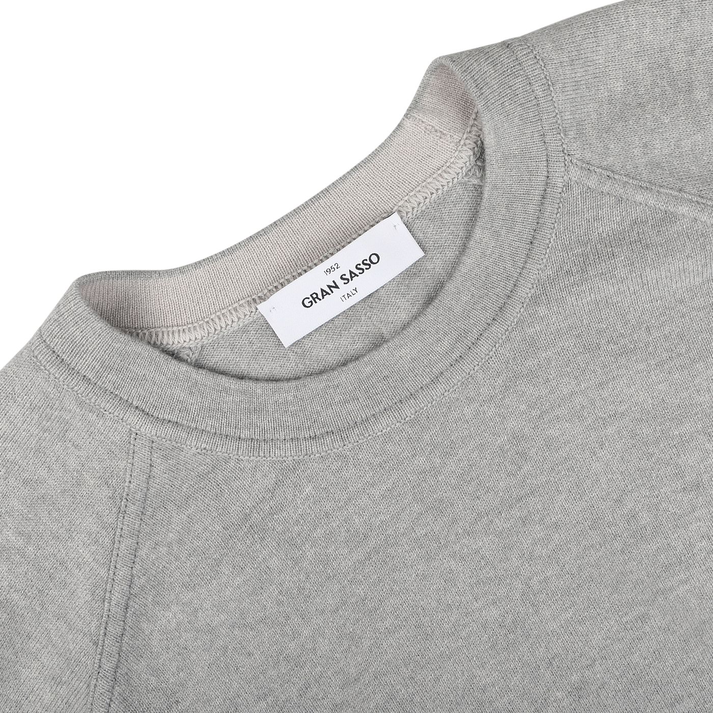 Light grey wool cashmere college sweater featuring a visible white label with the brand "Gran Sasso" and the text "Nido di Larice." This piece of sustainable knitwear is displayed flat on a white surface.