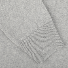 Close-up of a Gran Sasso Light Grey Wool Cashmere College Sweater, focusing on a sleeve with a ribbed cuff.