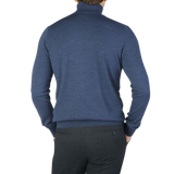 The back view of a man wearing a Gran Sasso Mid Blue Extra Fine Merino Roll Neck sweater.