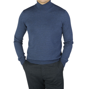 A man wearing a Gran Sasso Mid Blue Extra Fine Merino Roll Neck sweater.
