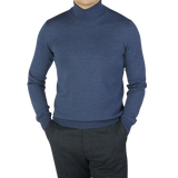 A man wearing a Gran Sasso Mid Blue Extra Fine Merino Roll Neck sweater.