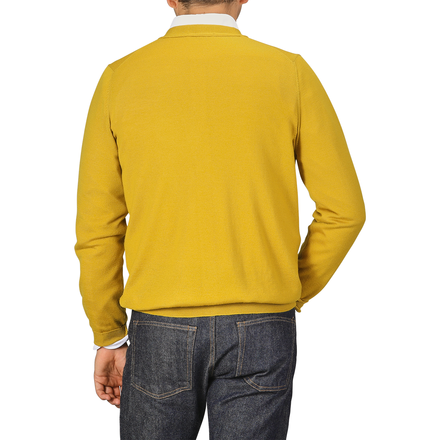 A person wearing a Mustard Yellow Extra Fine Merino Cardigan by Gran Sasso and dark jeans is photographed from behind.