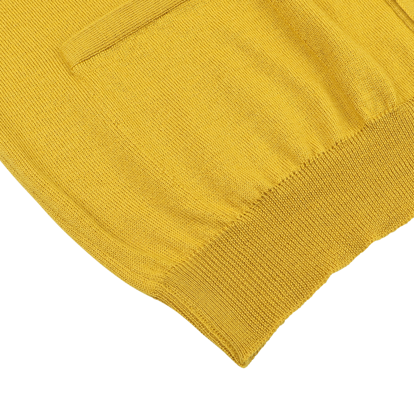 Close-up of the Gran Sasso Mustard Yellow Extra Fine Merino Cardigan, showcasing its luxurious soft texture and features such as a pocket and ribbed hem, laid flat on a white surface.