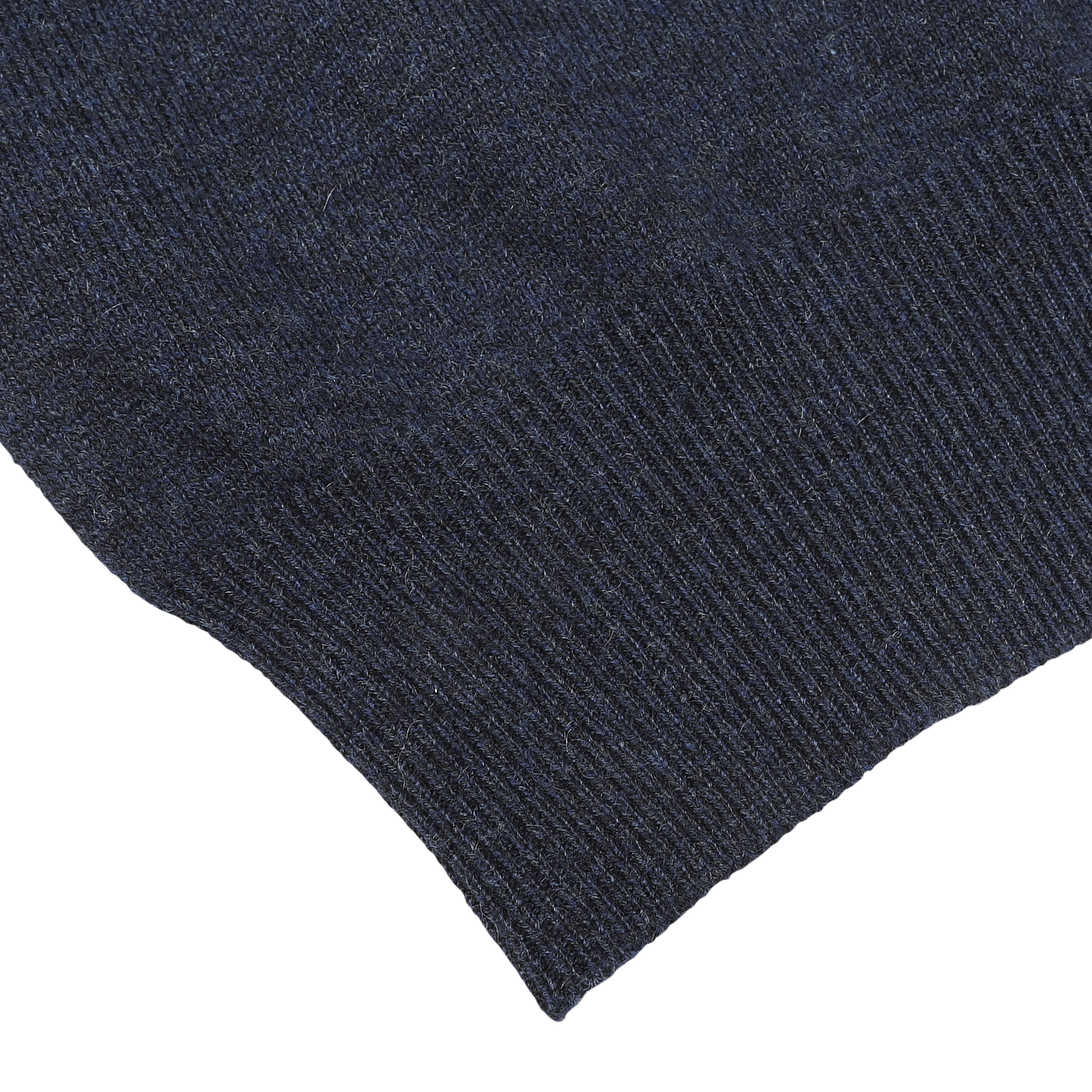 Close-up of a dark blue fabric with a ribbed texture along the bottom edge, reminiscent of the Gran Sasso Navy Blue Cashmere 1/4 Zip Sweater.