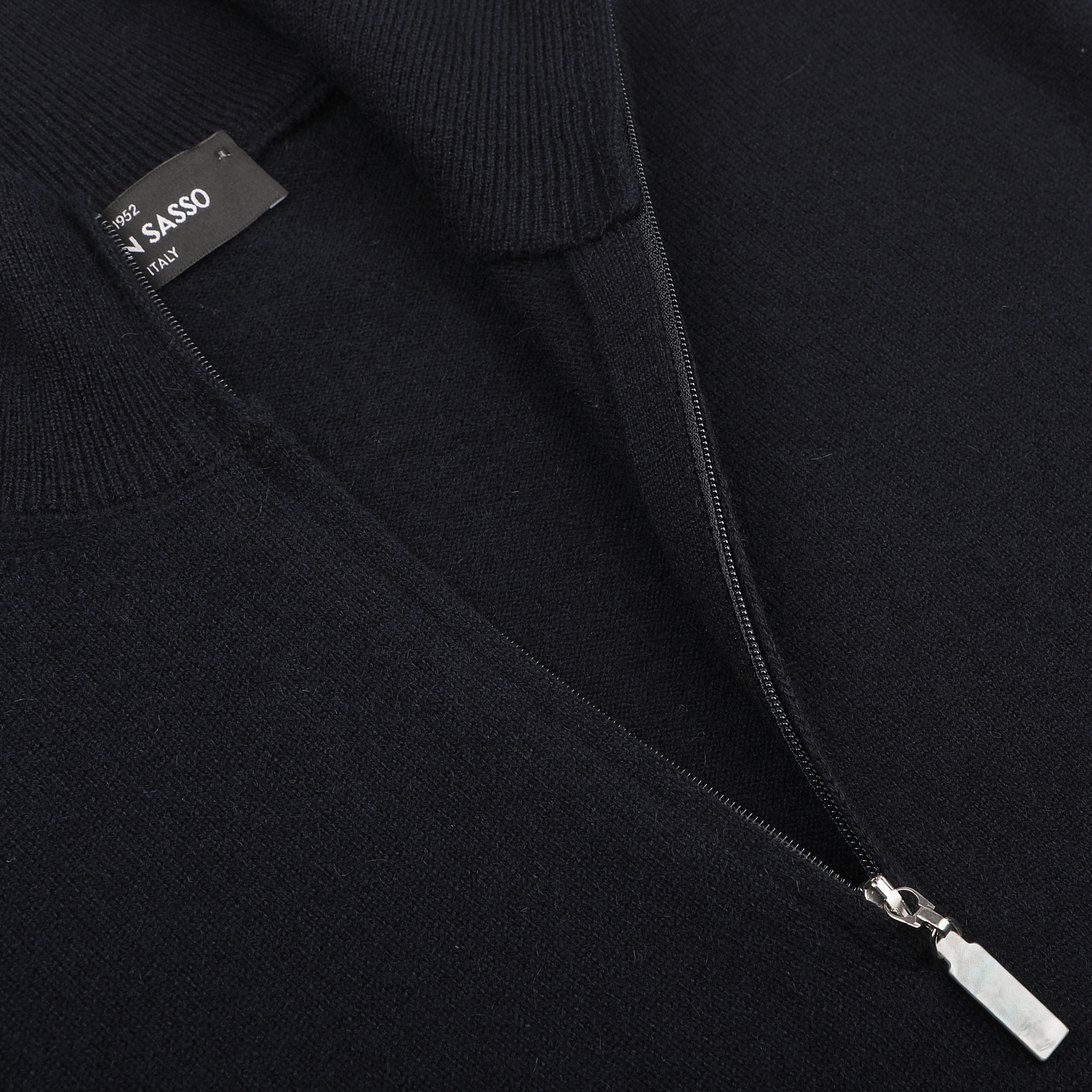 Close-up of a Navy Blue Cashmere 1/4 Zip Sweater by Gran Sasso, highlighting its premium knitwear quality and featuring a visible label on the inside collar.