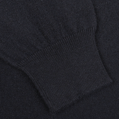 Close-up of a navy blue Gran Sasso cashmere crewneck sweater sleeve with a ribbed cuff, highlighting exquisite knitwear.