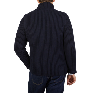 The back view of a man wearing a Gran Sasso Navy Blue Chunky Knitted Wool Cardigan.