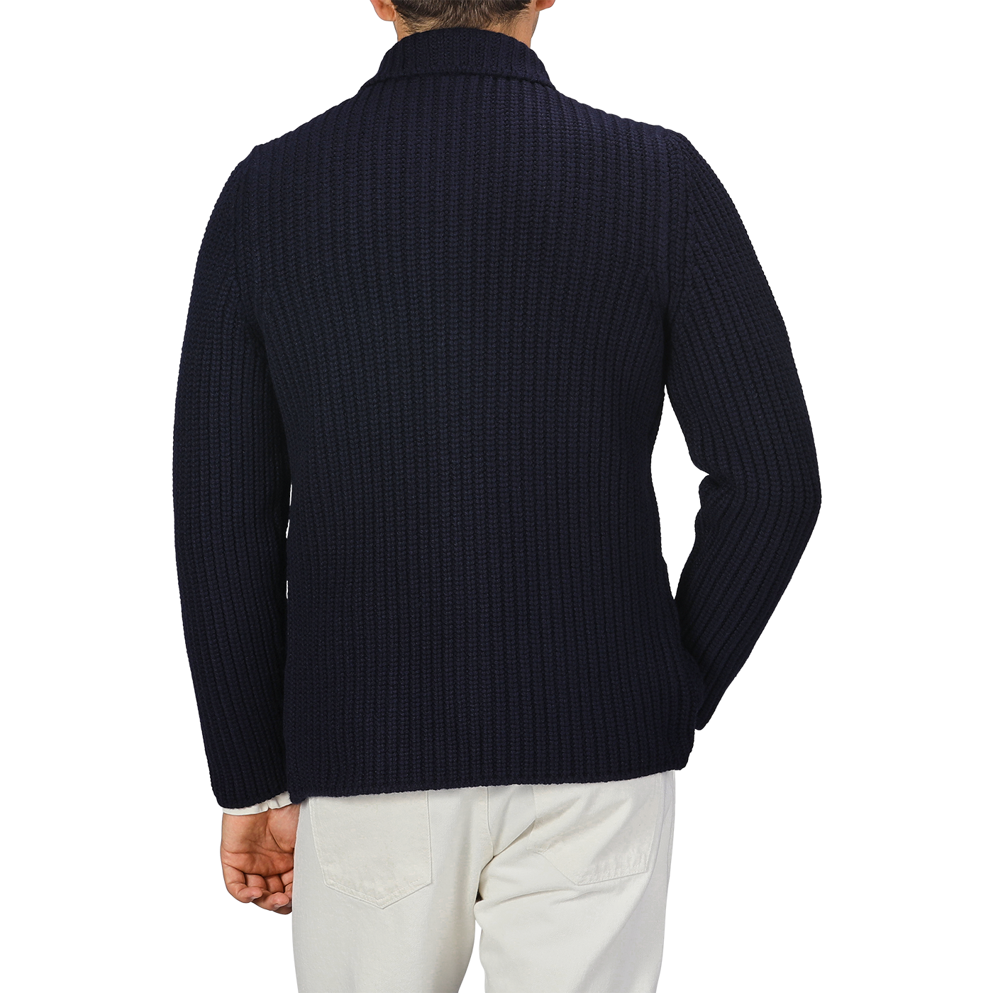 A person wearing a Navy Blue Chunky Knitted Wool Cardigan by Gran Sasso and light-colored pants is shown from the back.