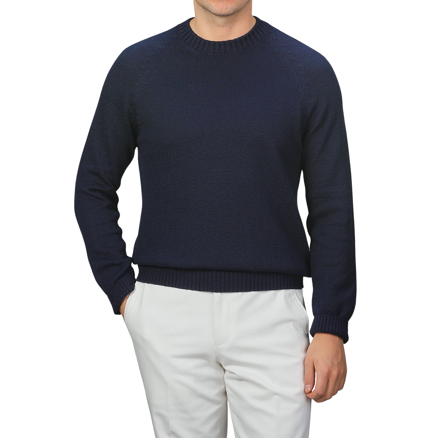 A person in a Gran Sasso Navy Blue Cotton Boucle Crewneck Sweater and white pants stands against a gray background, with the textured fabric adding depth. The person's head is not visible.