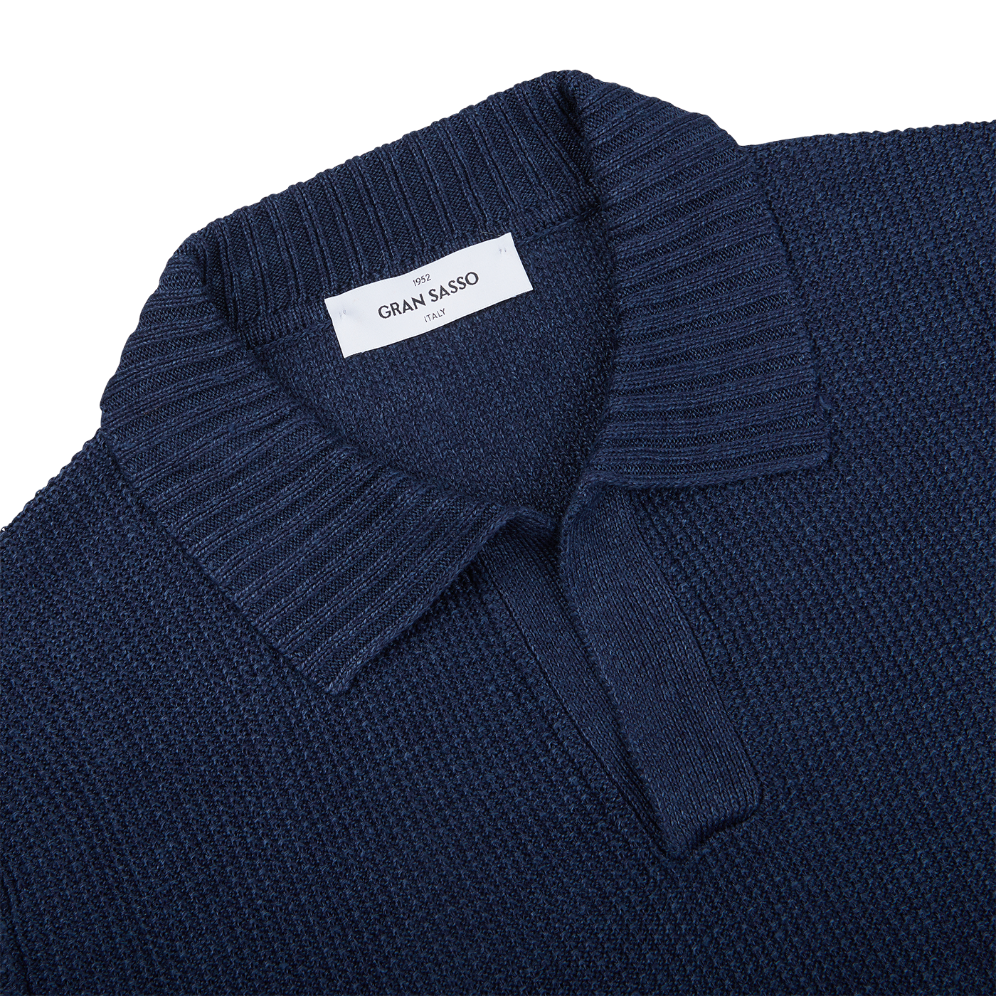 A close up of a Gran Sasso navy blue cotton linen polo shirt in a slim fit.