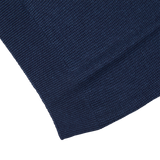 A close up of a Gran Sasso navy blue cotton-linen blend polo shirt.