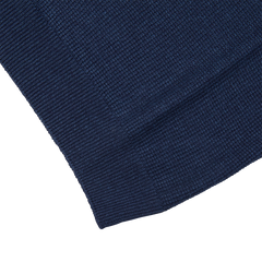 A close up of a Gran Sasso navy blue cotton-linen blend polo shirt.